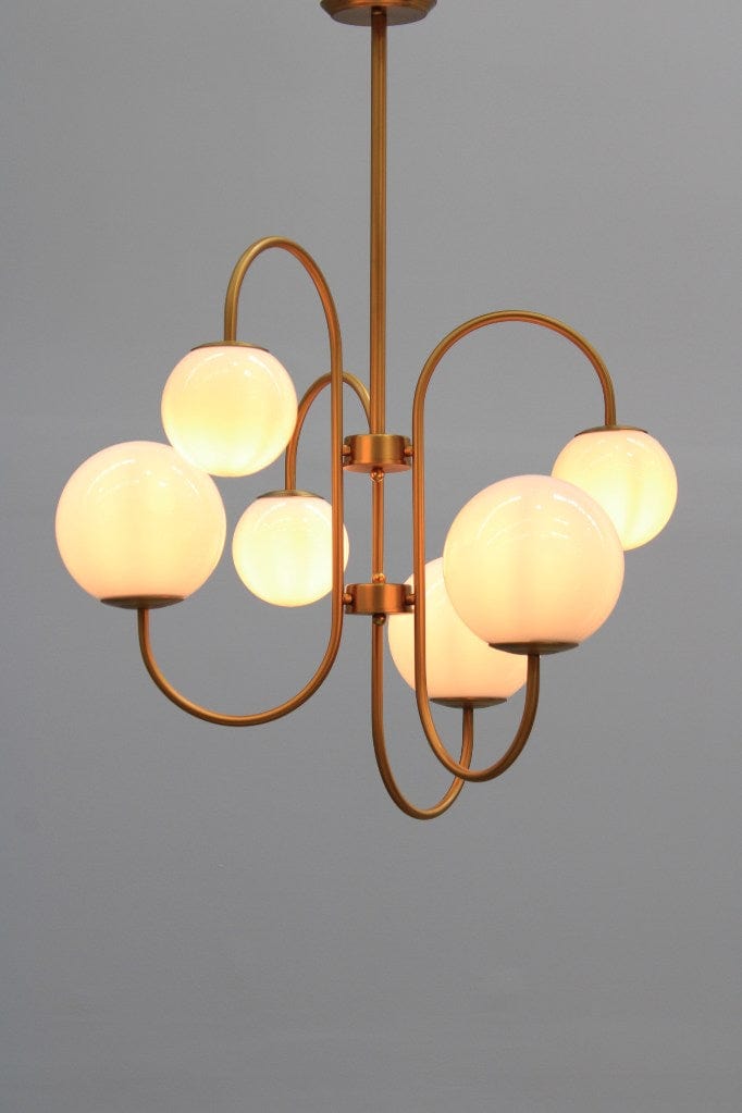 Six light chandelier in a gold finish