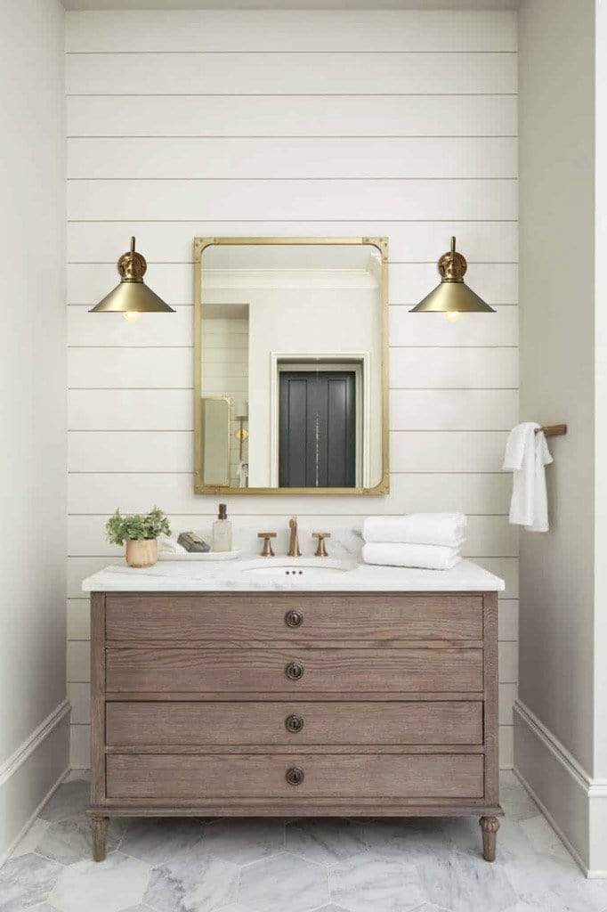 Brass-wall light in bathroom