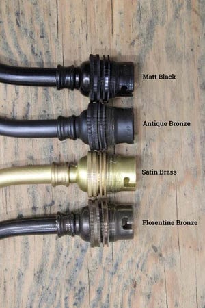 four  brass wall sconce finishes