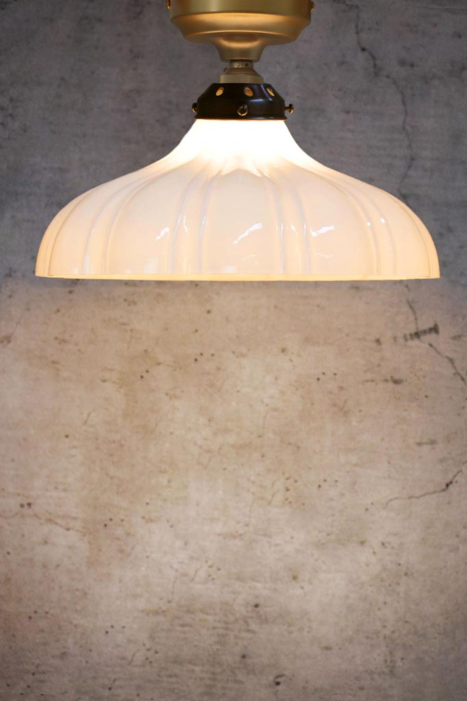 Large glass shade with gold batten