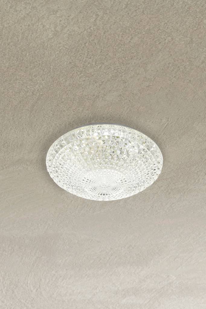 Small variant of flush mount light affixed on ceiling