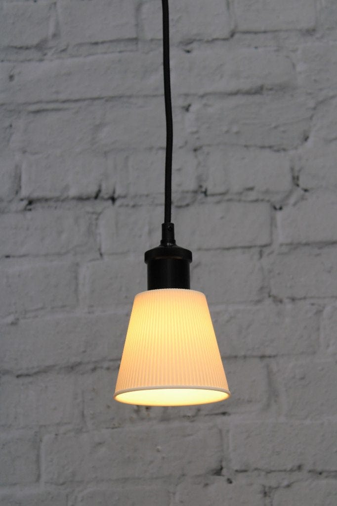 Small ceramic pendant light with black cord