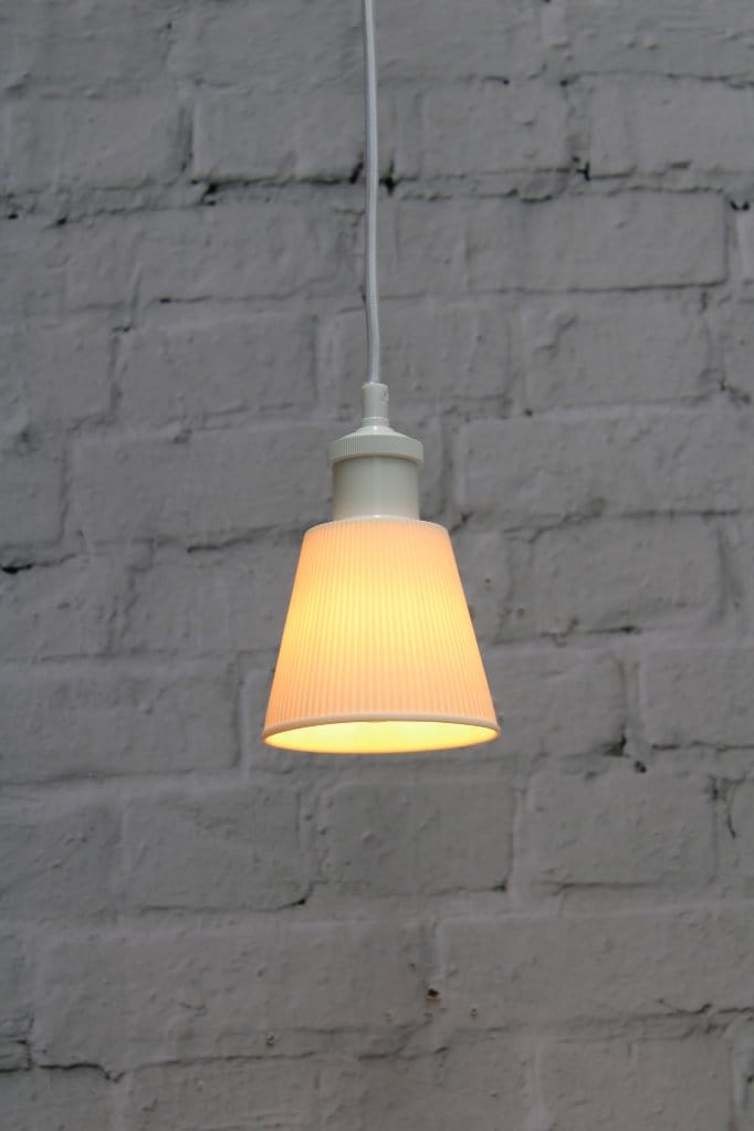 Small ceramic pendant light with white cord