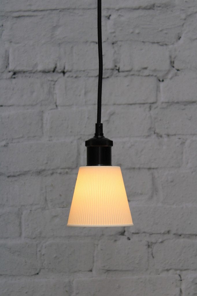 Small ceramic pendant light with black cord