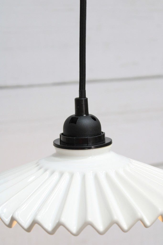 Black pendant cord with white ceramic shade