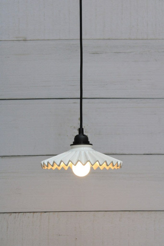 Black pendant cord with white ceramic shade