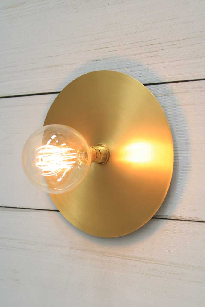 Large brass disc wall light