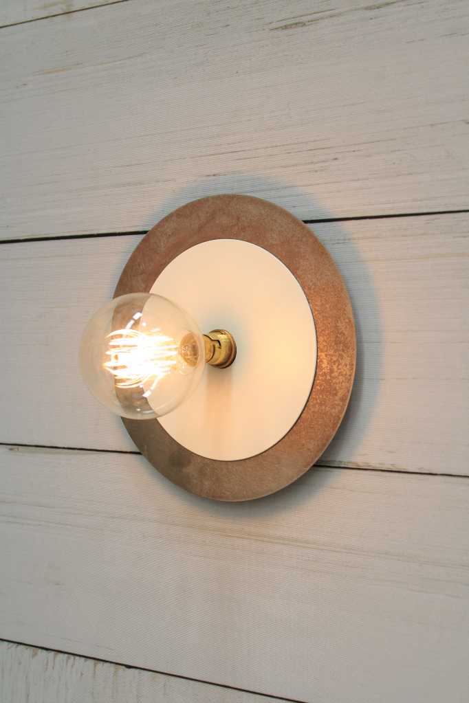 Large metal with small white disc wall light