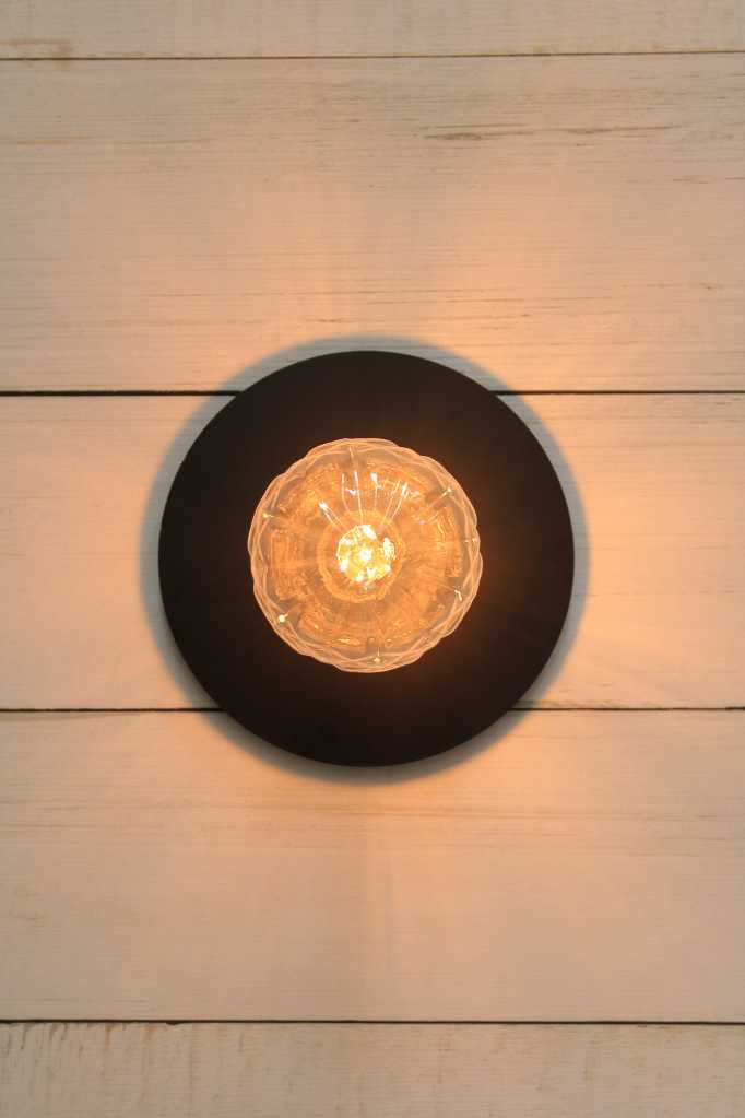 Large black disc wall light