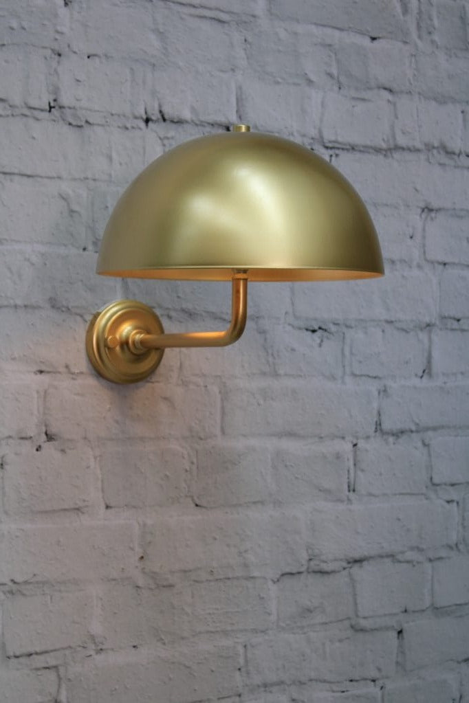 Gold/brass wall sconce with gold/brass shade