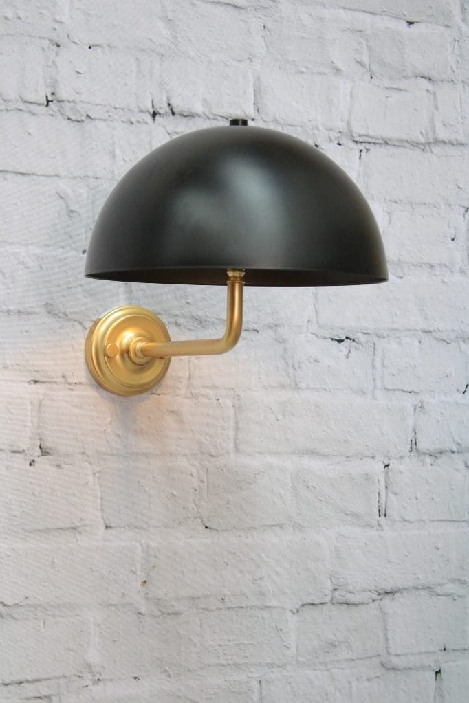 Gold/brass wall sconce with black shade