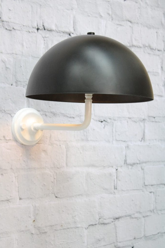 White wall sconce with black shade