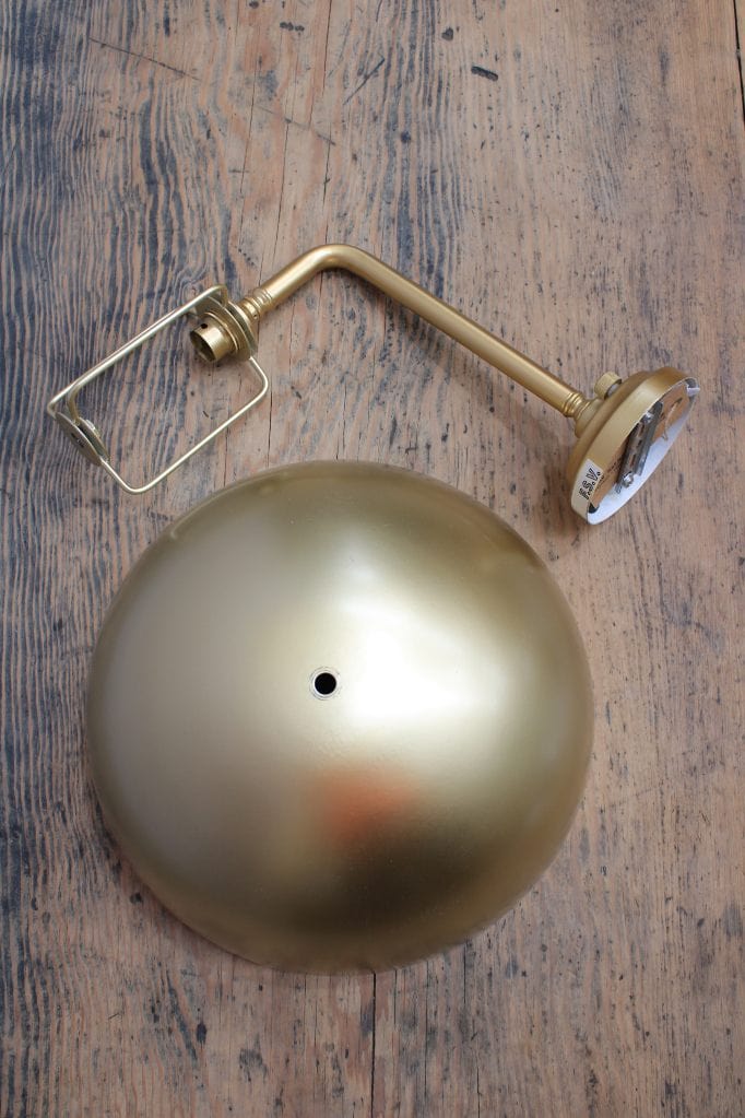 Gold/brass wall sconce with gold/brass shade