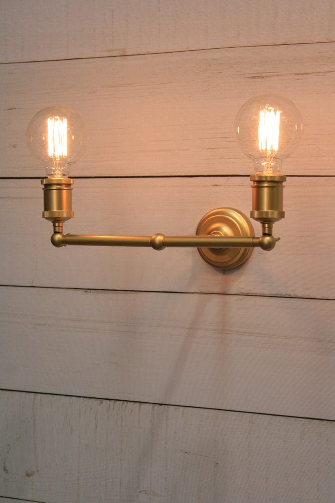 Double arm sconce in gold, upright position