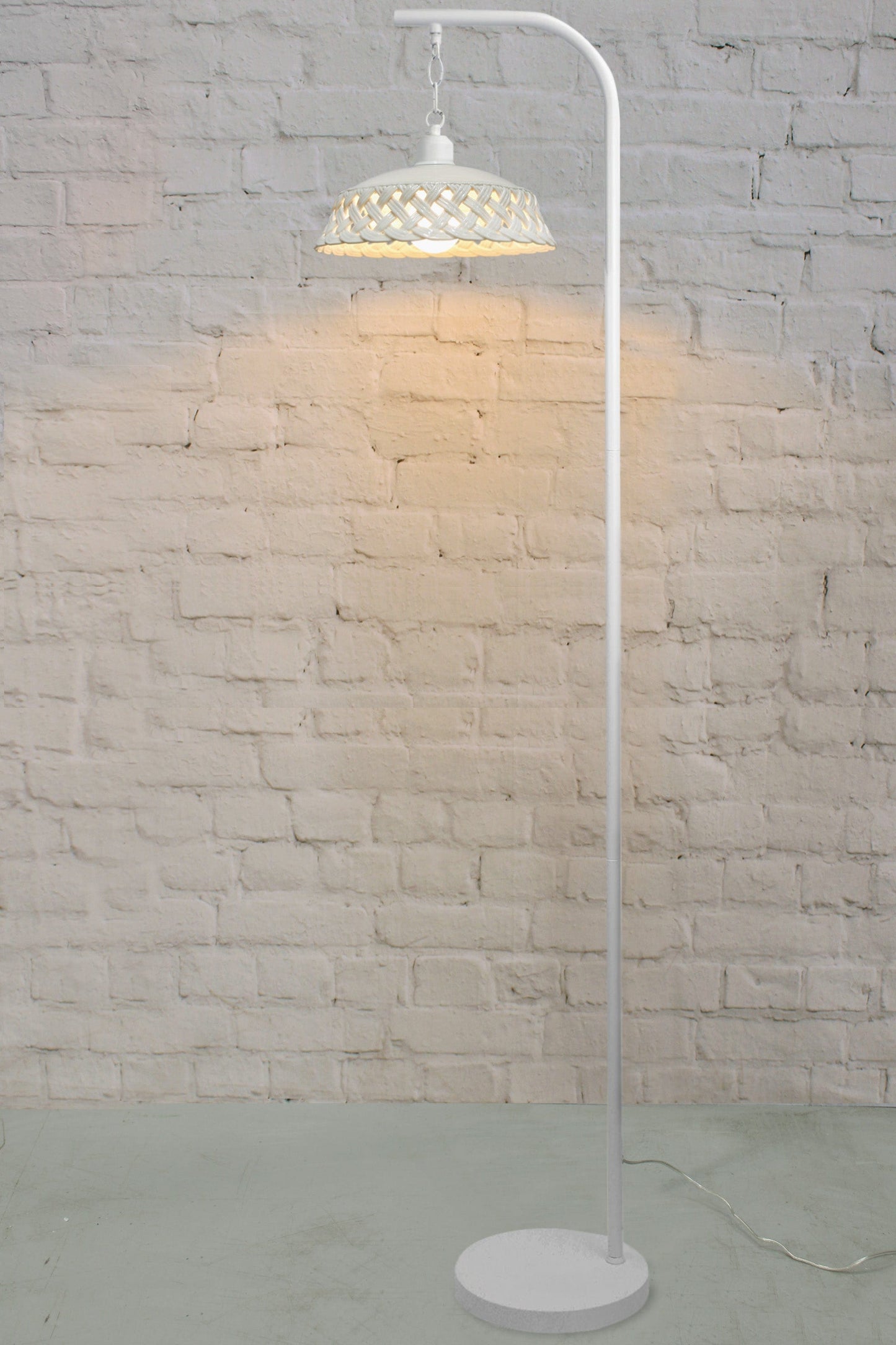 Ceramic floor lamp with white base. 