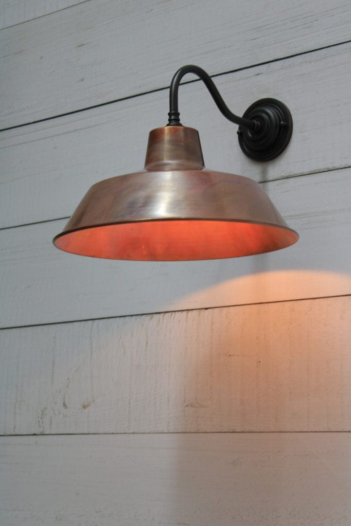 Factory wall light with matt black brass gooseneck sconce and aged copper shade