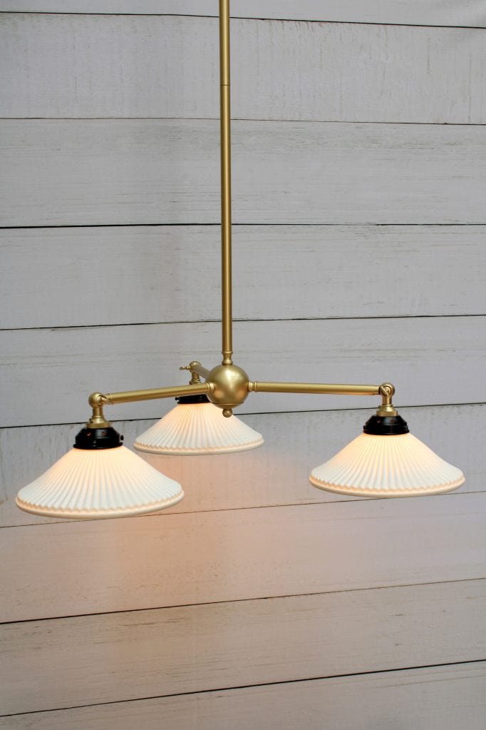 Gold/brass three light pendant with ceramic shades