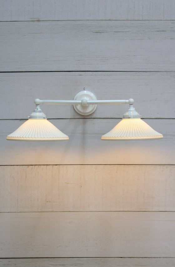 Double arm wall light with white finish and ceramic shades