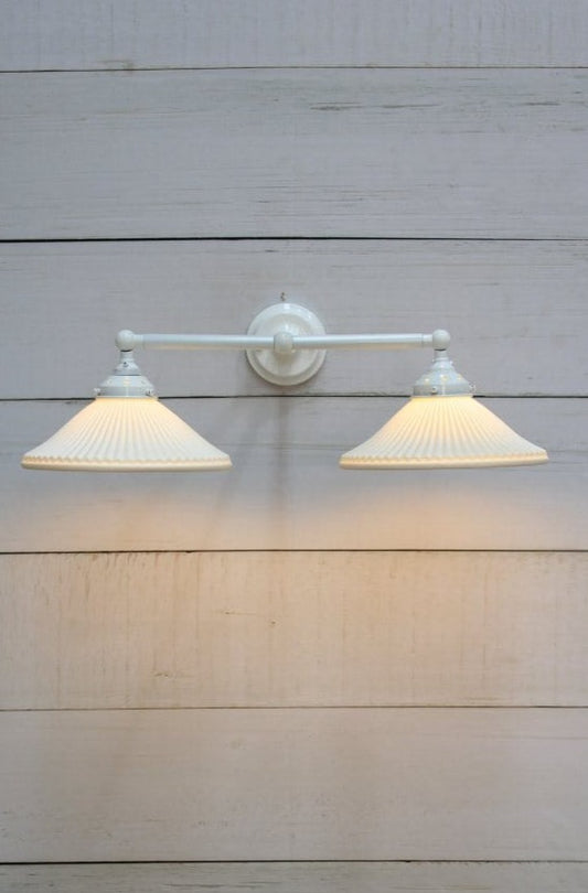 Double arm wall light with white finish and ceramic shades