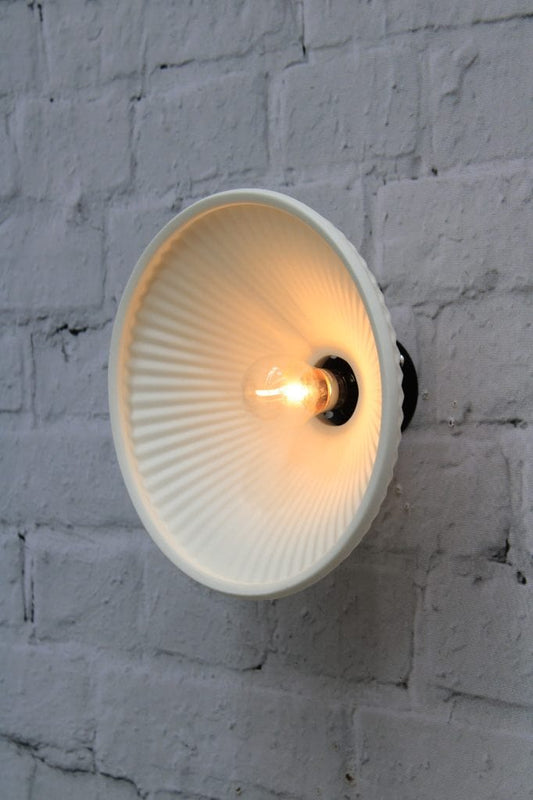 Pleated ceramic wall mounted light