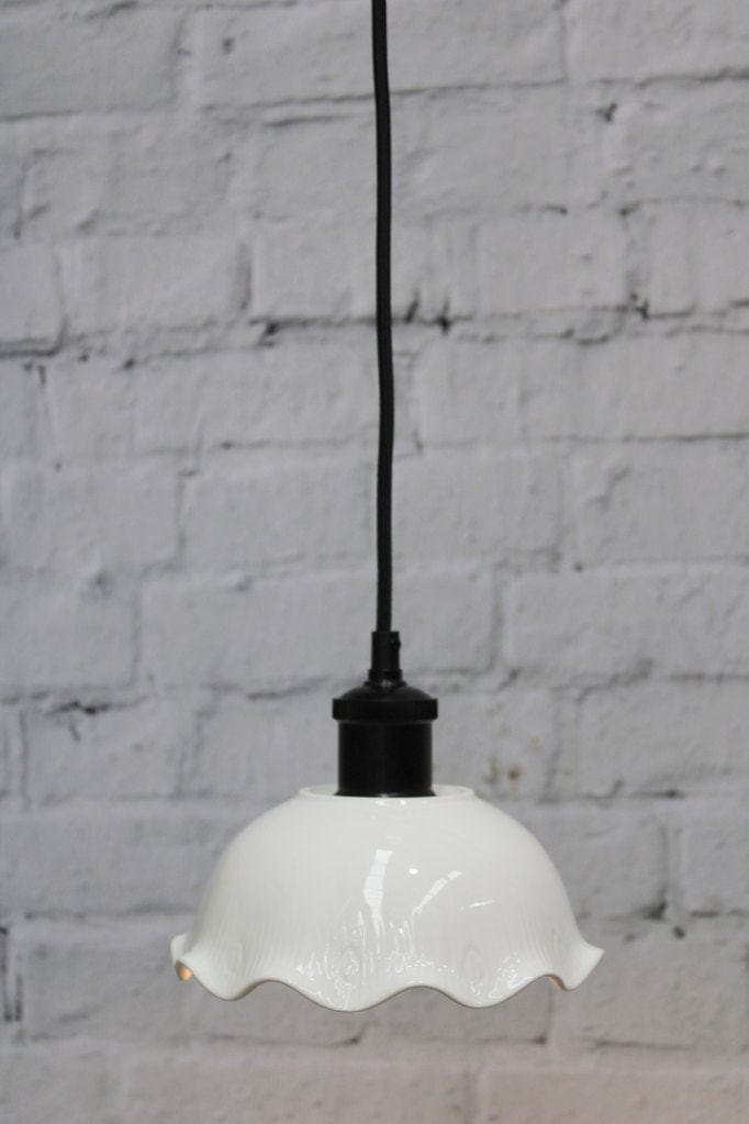 Frilled ceramic pendant with black cord