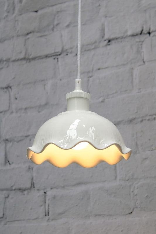 Frilled ceramic pendant with white cord