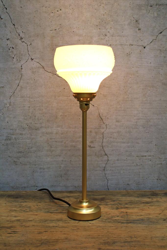 Gold table lamp with matching gallery