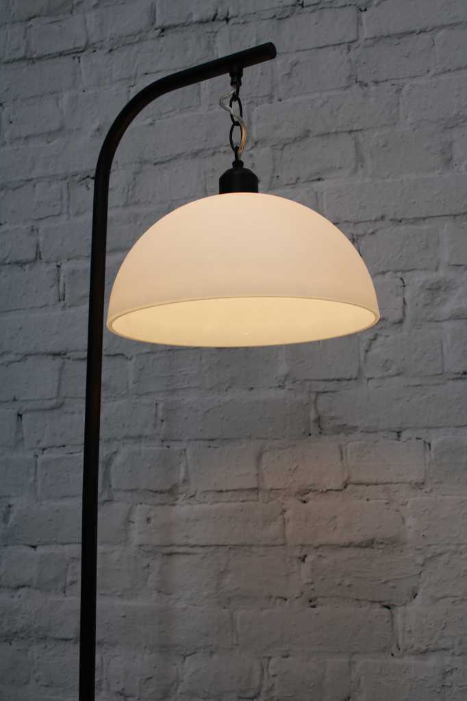 black floor lamp with opal glass dome shade