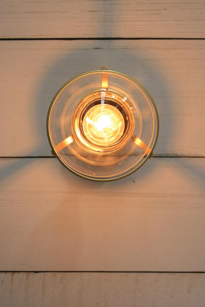 Huxley ceiling light in gold finish with small clear shade from below