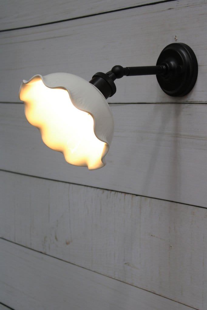 Wall light with black short arm extended 