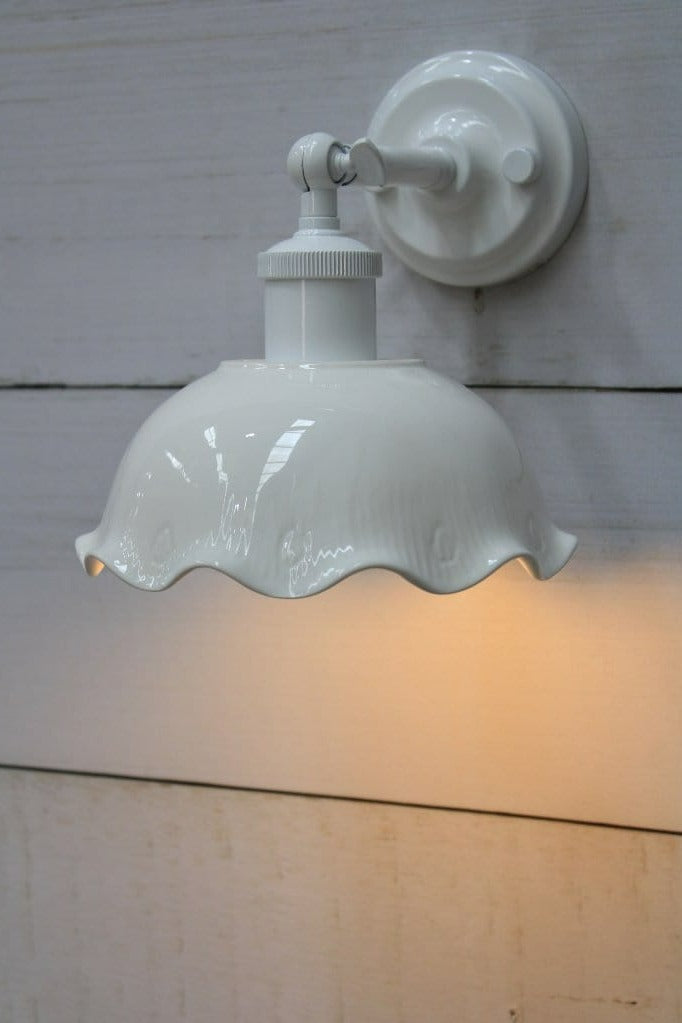 Detailing on wall light with white short arm