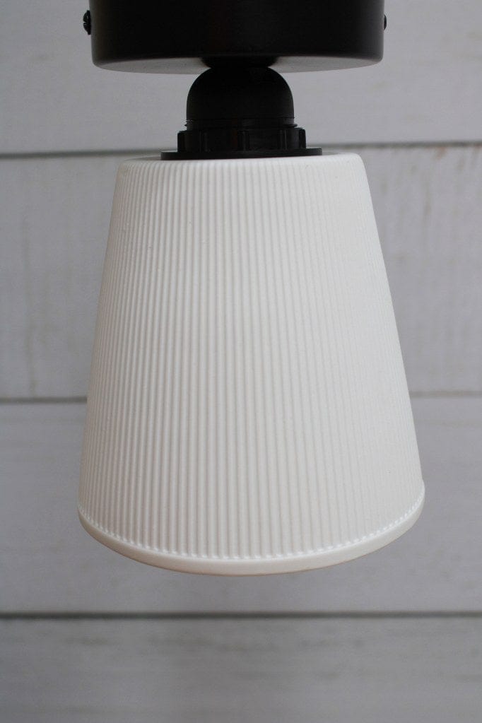 Ceiling light with black base and large ceramic shade