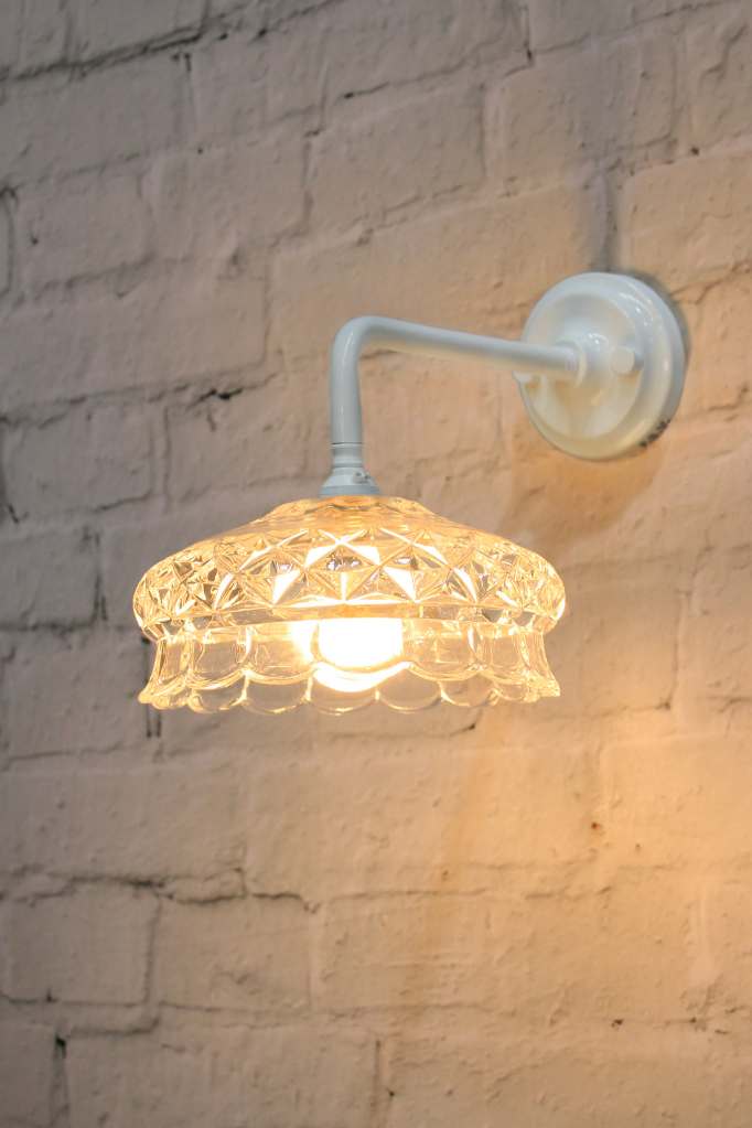 White wall light with cut glass style shade