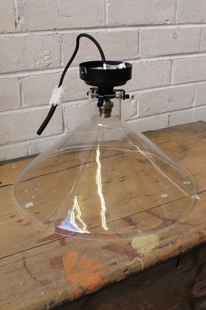 Lab funnel batten light attaches to the ceiling with a metal batten lamp holder and glass shade