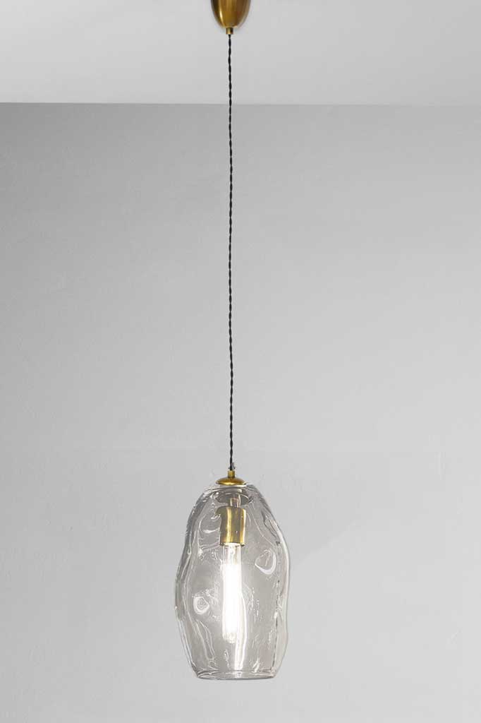 Large mouth blown glass pendant light with brass finish