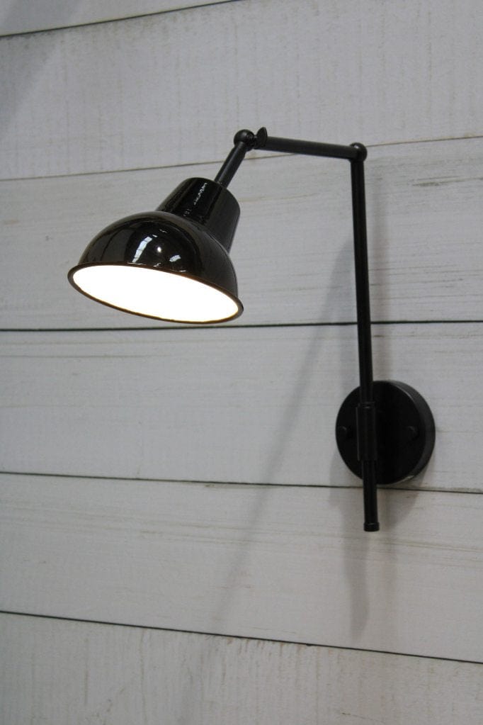 Black wall sconce with black and white shade