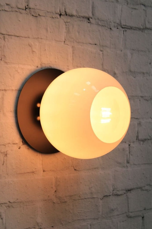 Large disc wall light with open glass shade