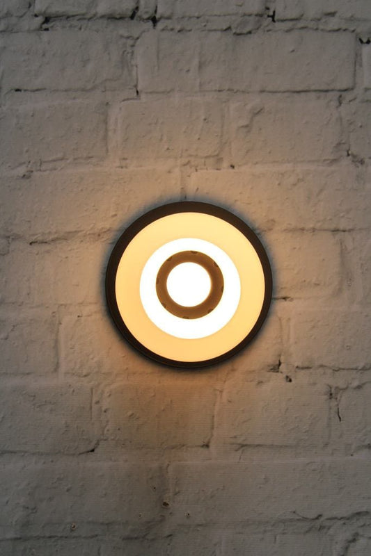 Small disc wall light with open glass shade