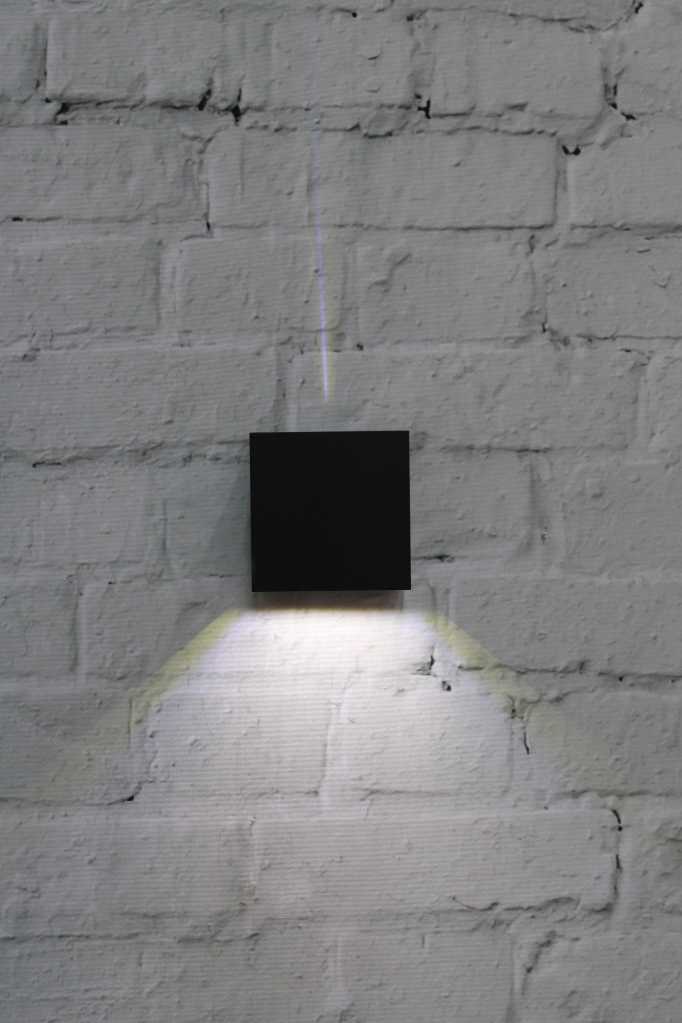 Monmouth LED Exterior Light creating a down light in black