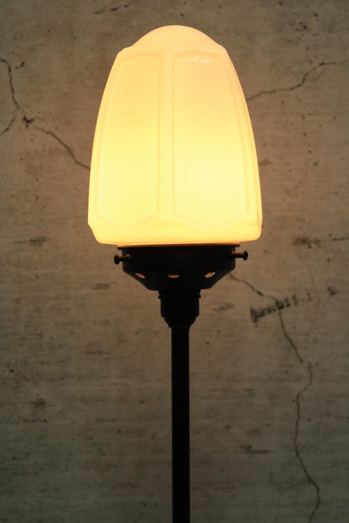 Black table lamp with opal glass shade