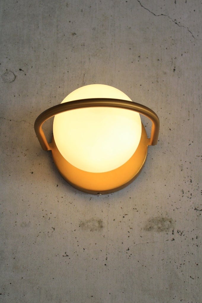 gold wall light in horizontal orientation