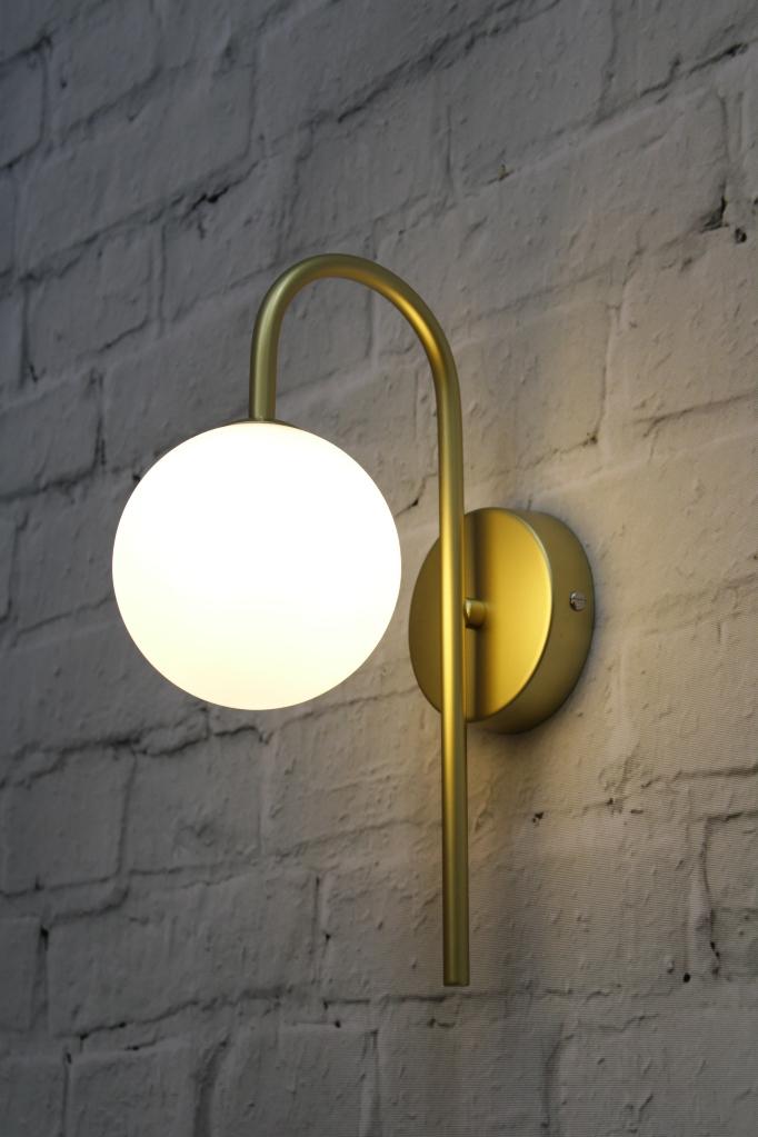 Gold opal wall light from below