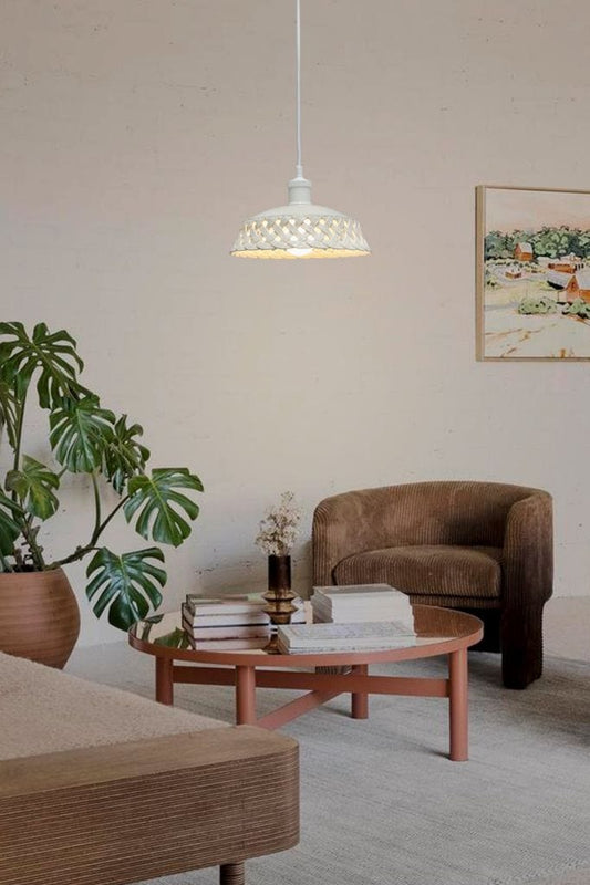 Ceramic pendant light suspended over coffee table