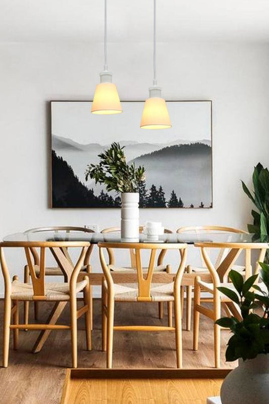 Ceramic pendant lights over dining room table