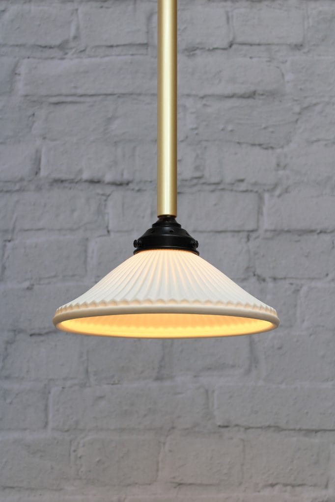 Ceramic shade on gold/brass pole pendant light