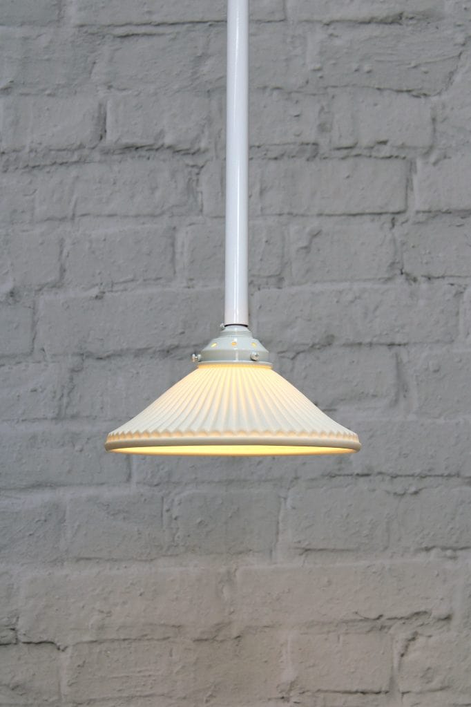 Ceramic shade on white pole pendant