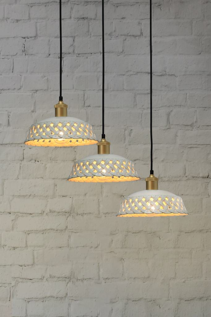 Gold/brass finish three light pendant with white ceramic shades