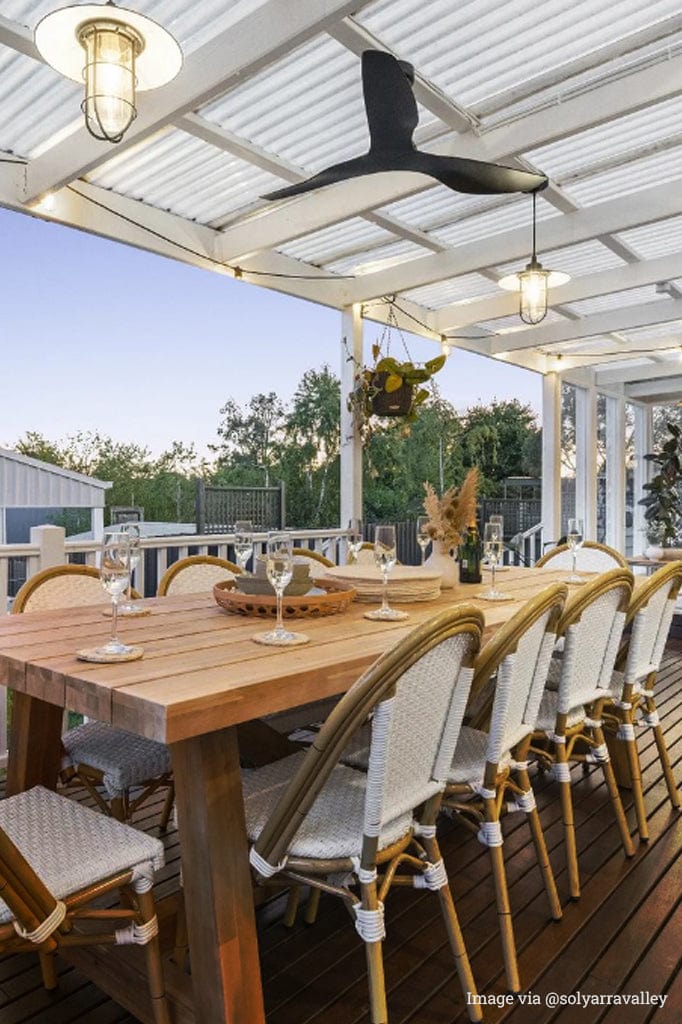 Miner Ceiling Lights over outdoor dining table.