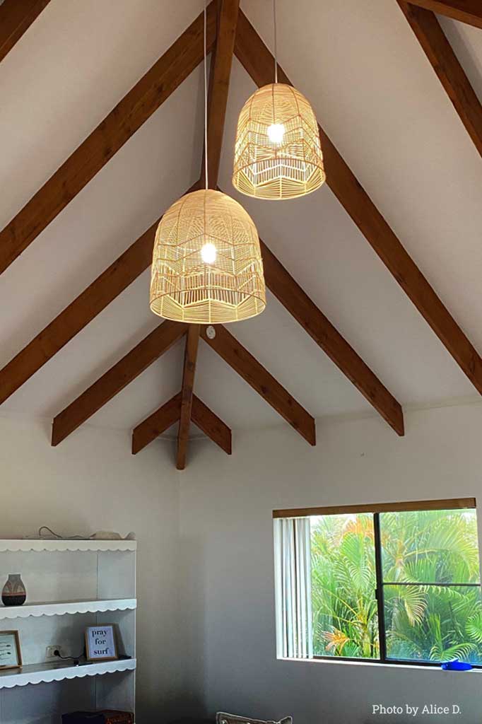 2 Beechmont Rattan Pendant in a living room.