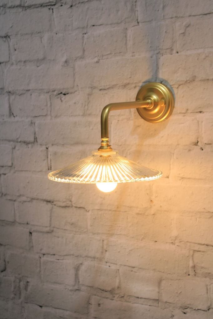 Glass wall light with gold/brass wall sconce